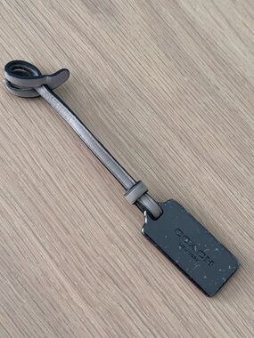 COACH Gunmetal Hang Tag With Grey Leather Strap